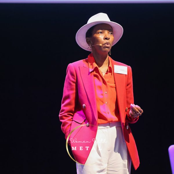 Lily Samuels delivering a presentation on women’s health and performance at a Women With Metal Conference.